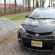 Pictured: a Corolla in front of its natural habitat, a high school parking lot.